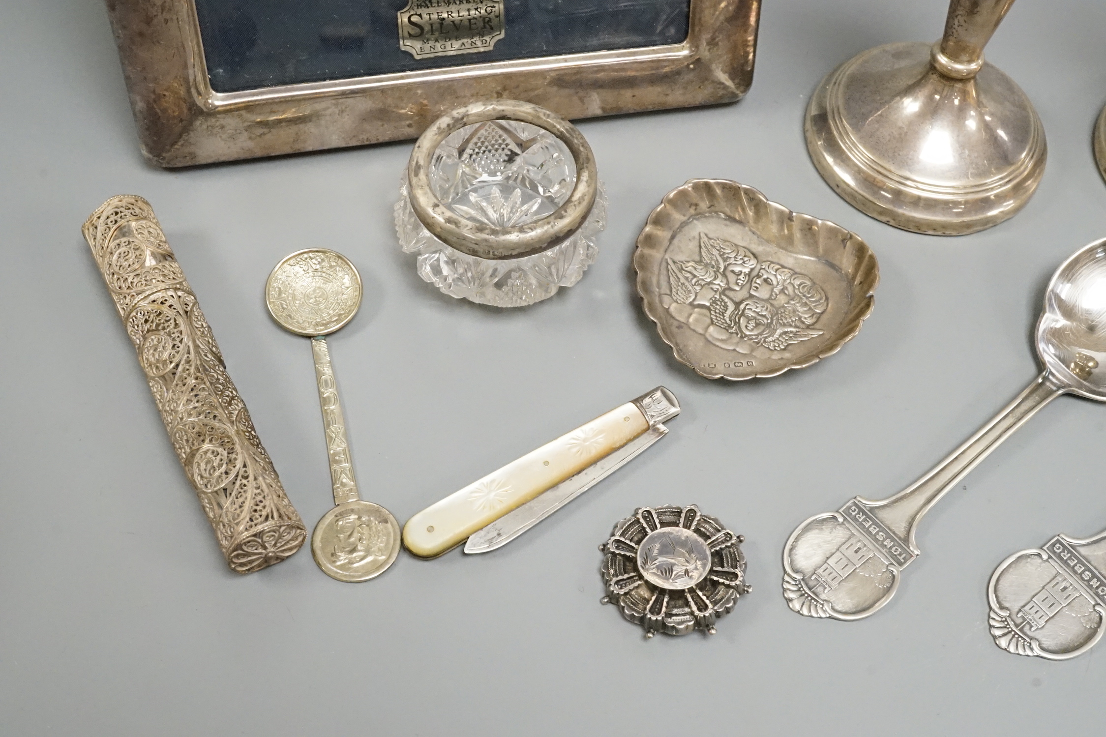 Sundry silver and white metal including a pair of modern candlesticks and a similar photograph frame.